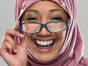 Milton Orthodontics Adult Woman with Hijab and Clear Ceramic Braces with Glasses, Beautiful